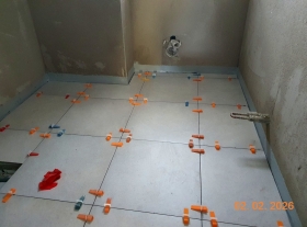  - Pokládka dlažby v koupelnách